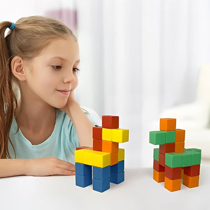 fille regarde ses figurines en cubes magnétiques